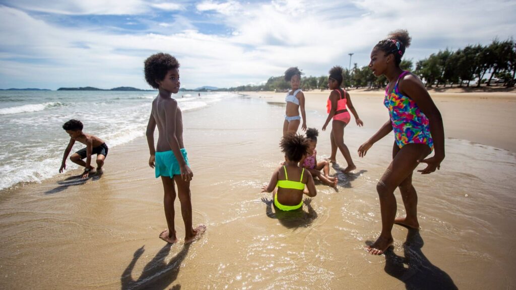 Black Kids Having Fun On The Beach