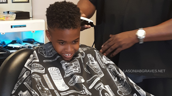 Handsome Black Boy Getting A Haircut