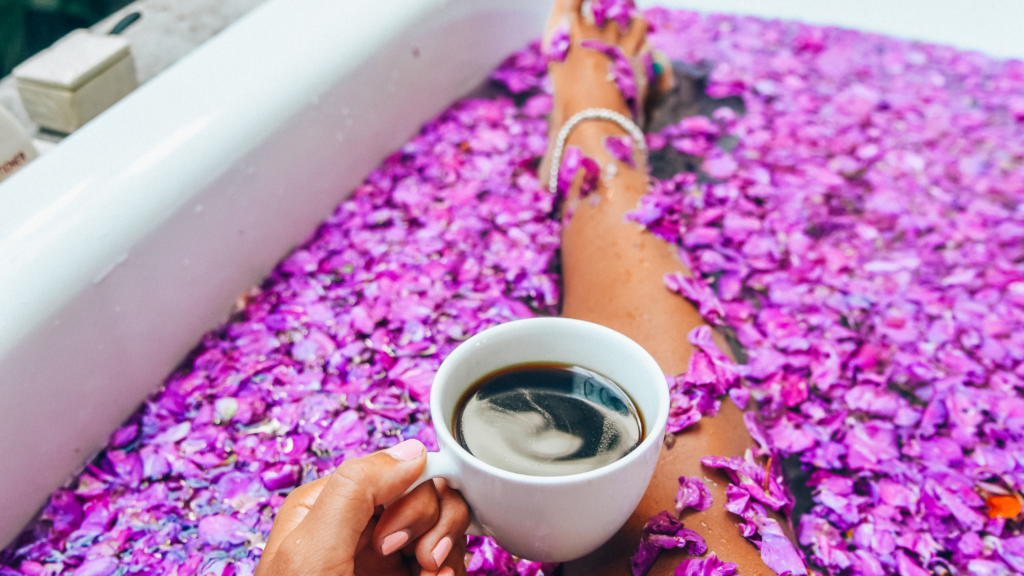 Black Woman In Bathtub Filled With Rose Petals