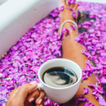 Black Woman In Bathtub Filled With Rose Petals